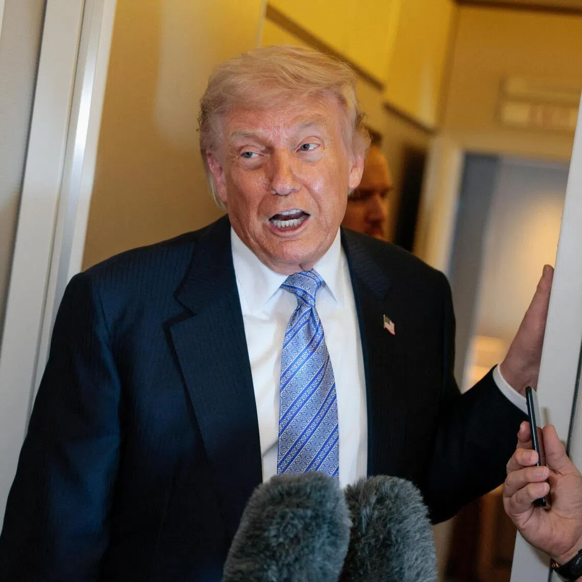 US President Donald Trump speaking to the press aboard Air Force One on May 15, following his official visit to China.