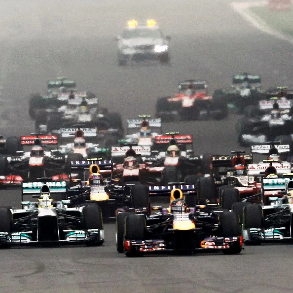 FILE PHOTO: Red Bull Formula One driver Sebastian Vettel of Germany leads the field at the start of the Indian F1 Grand Prix at the Buddh International Circuit in Greater Noida, on the outskirts of New Delhi,  October 27, 2013. REUTERS/Adnan Abidi /File Photo