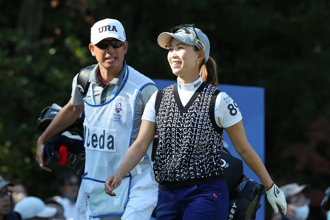 Momoko Ueda of Japan smiles after a tee shot during the first round of the LPGA Japan Classic.