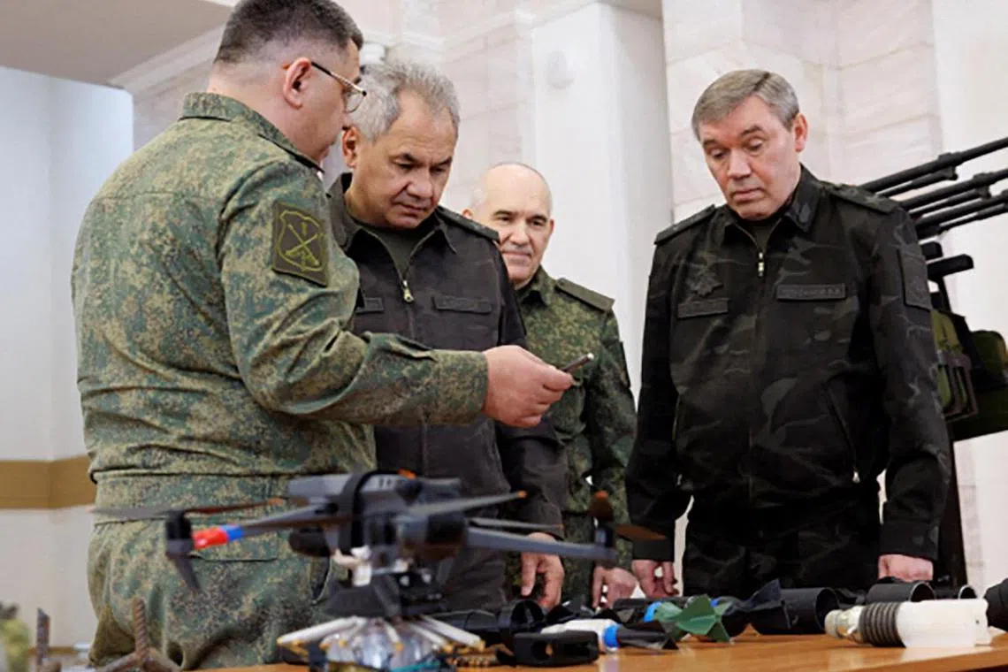 Arrest warrants have been issued by the International Criminal Court for former Russian defence minister Sergei Shoigu (second from left) and Chief of the General Staff Valery Gerasimov (far right).