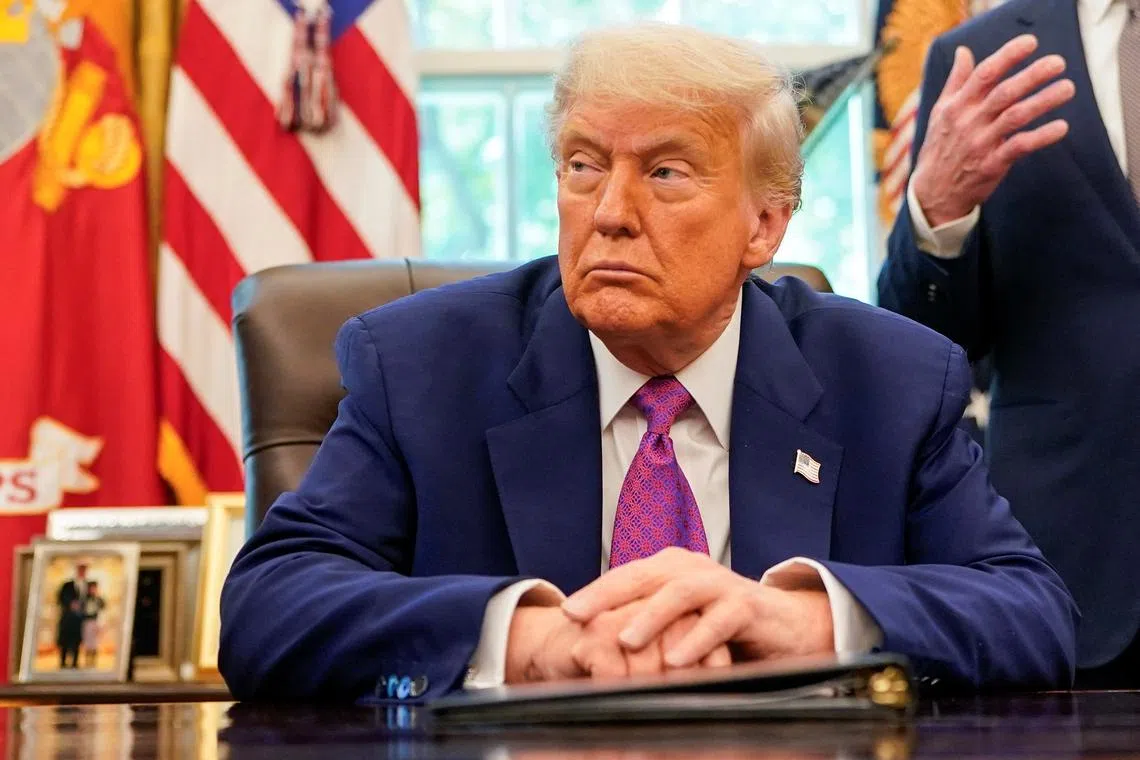 U.S. President Donald Trump sits in the Oval Office at the White House, in Washington, D.C., U.S., June 10, 2025. REUTERS/Nathan Howard