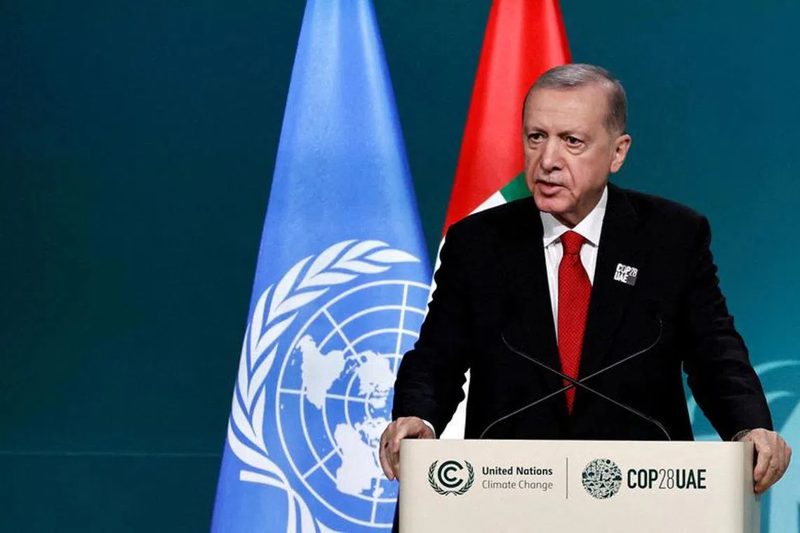 FILE PHOTO: Turkish President Tayyip Erdogan delivers a national statement at the World Climate Action Summit during the United Nations Climate Change Conference (COP28) in Dubai, United Arab Emirates, December 1, 2023. REUTERS/Thaier Al Sudani/File Photo
