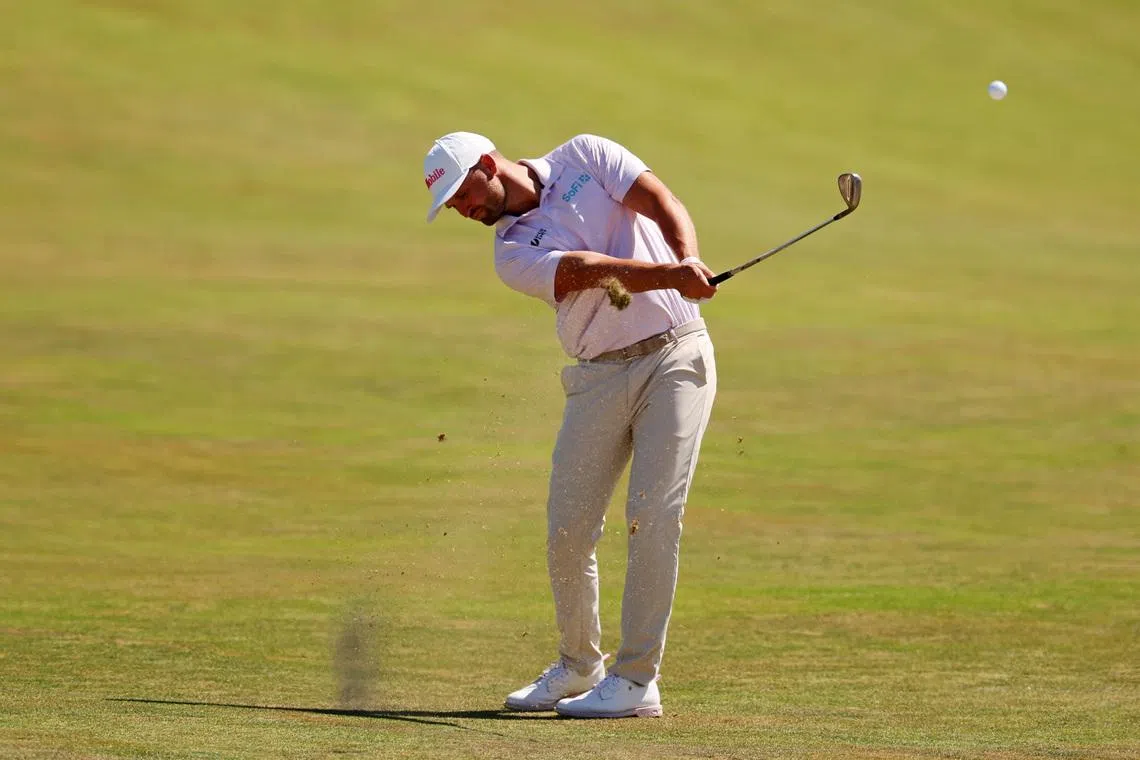 Wyndham Clark makes his play on the third fairway during the final round of the U.S. Open golf tournament at Shinnecock Hills Golf Club.