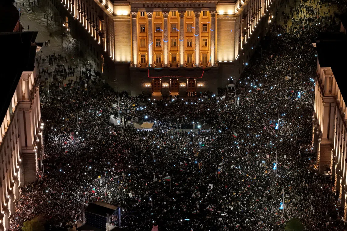A drone view shows protesters gathering during a demonstration organised by Bulgaria’s opposition PP-DB coalition against the proposed financial framework of the country's budget, outside the parliament, in Sofia, Bulgaria, December 1, 2025. REUTERS/Spasiyana Sergieva