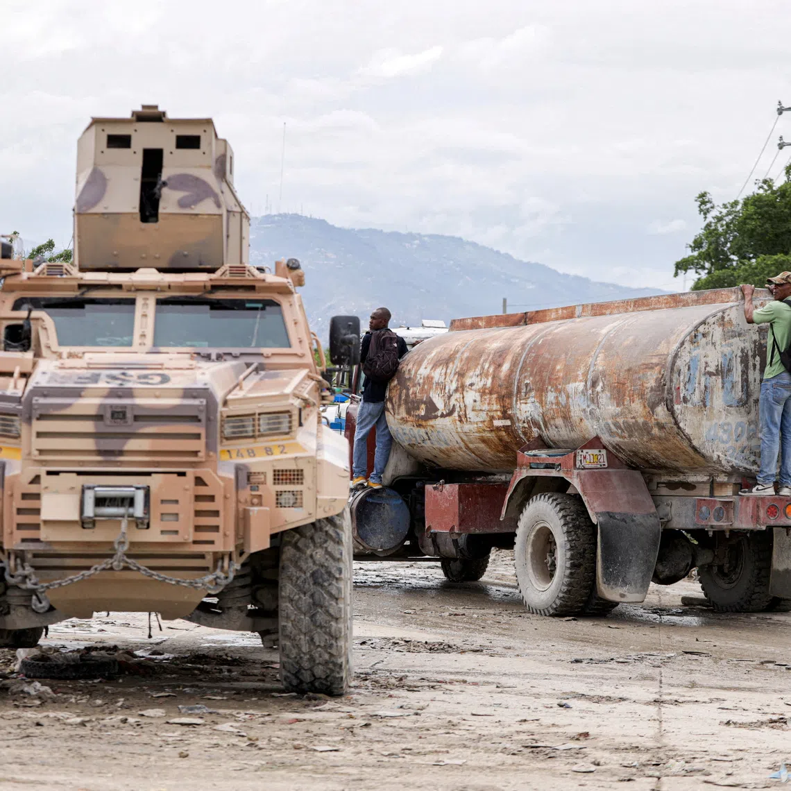 FILE PHOTO: An armored personnel carrier of Haiti's UN-backed Gang Suppression Force (GSF) patrols an area after El Salvador announced a rescue mission for four air force members in the GSF that went missing after a gang ambush, in Port-au-Prince, Haiti, October 23, 2026. REUTERS/Patrice Noel/File Photo