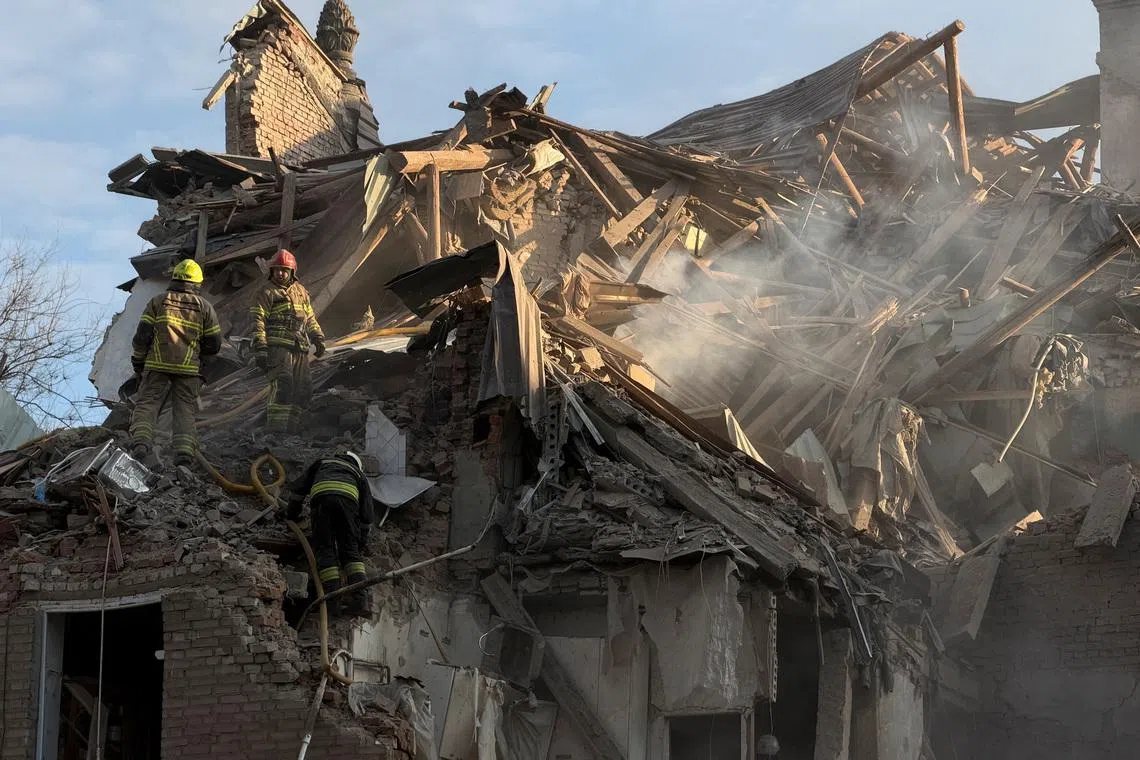 Rescuers work at the site of an apartment building hit by a Russian drone and missile strike, amid Russia's attack on Ukraine, in Dnipro, Ukraine April 25, 2026. Picture taken using a mobile phone. REUTERS/Serhii Chalyi