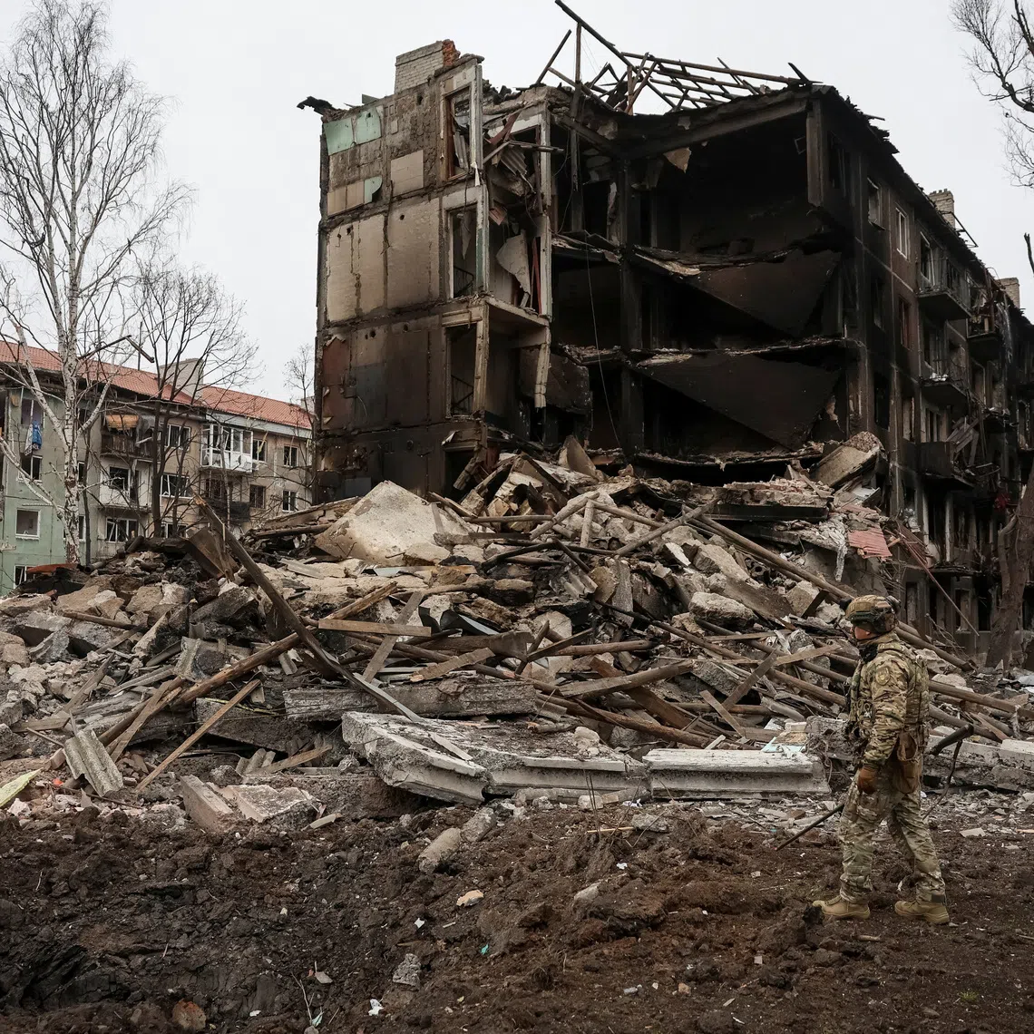 FILE PHOTO: A member of the White Angel unit of Ukrainian police officers, who evacuate people from the frontline towns and villages, checks an area for residents, amid Russia's attack on Ukraine, in the frontline town of Dobropillia in Donetsk region, Ukraine December 9, 2025. REUTERS/Anatolii Stepanov/ File Photo