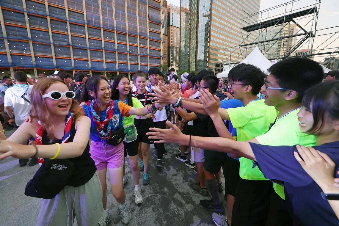 Scouts attending an international jamboree in South Korea join a mass dance event in Seoul.