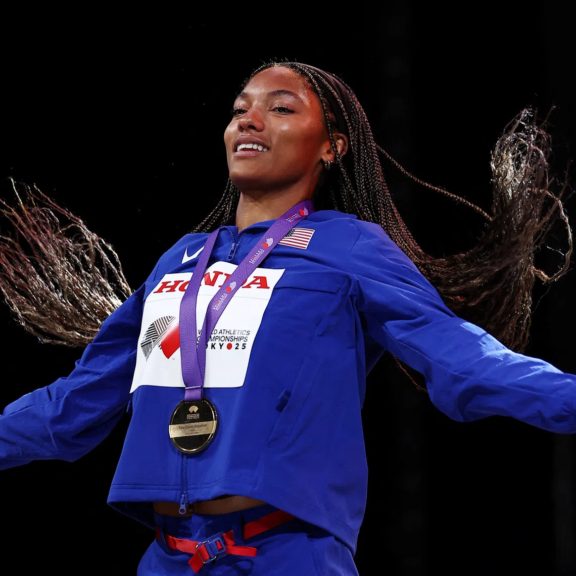 World Athletics Championships Tokyo 2025 - Women's Long Jump Medal Ceremony - Japan National Stadium, Tokyo, Japan - September 15, 2025 Gold medallist Tara Davis-Woodhall of the U.S. celebrates on the podium REUTERS/Eloisa Lopez/File Photo