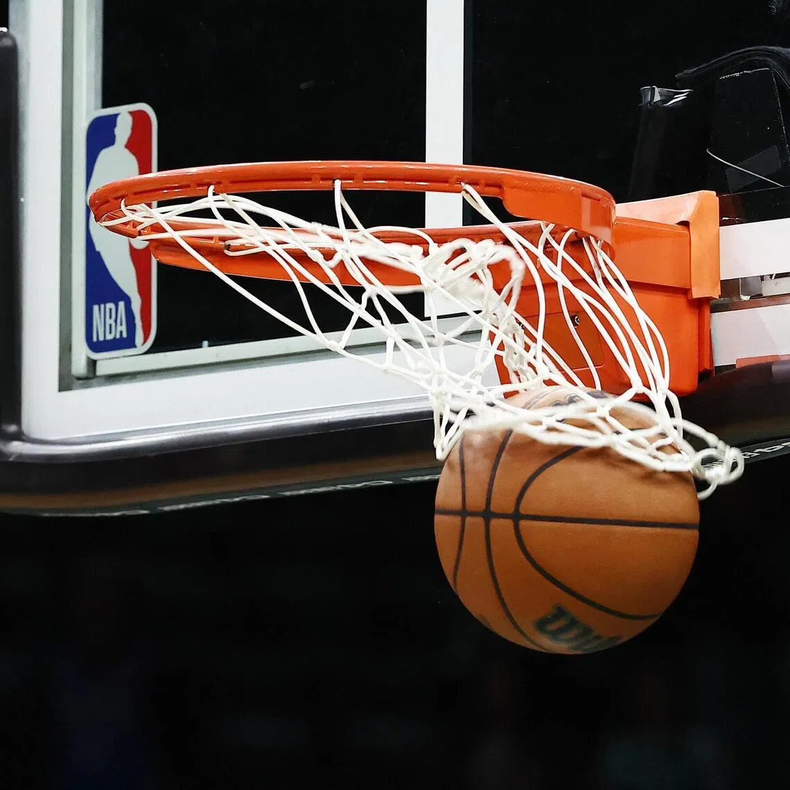 An NBA ball goes through the basket before the game between the Boston Celtics and the Oklahoma City Thunder at TD Garden in Boston on March 25, 2026.