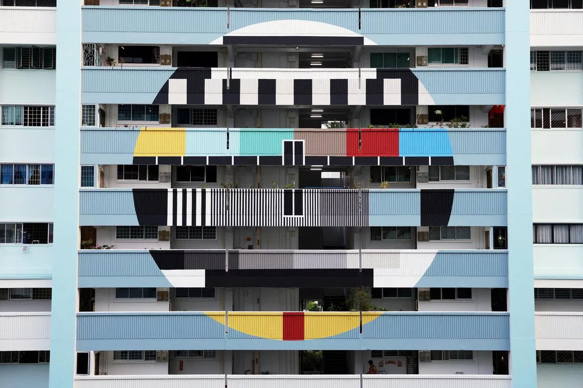 The facade of a Housing Development Board (HDB) block painted with a television test pattern in Tampines, Singapore on March 30, 2026.