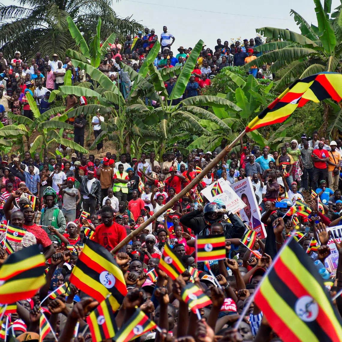 Supporters of Ugandan Presidential candidate Robert Kyagulanyi, also known as Bobi Wine, of the National Unity Platform (NUP) party, gather at his campaign rally ahead of the general elections in Kampala, Uganda December 8, 2025. REUTERS/Abubaker Lubowa
