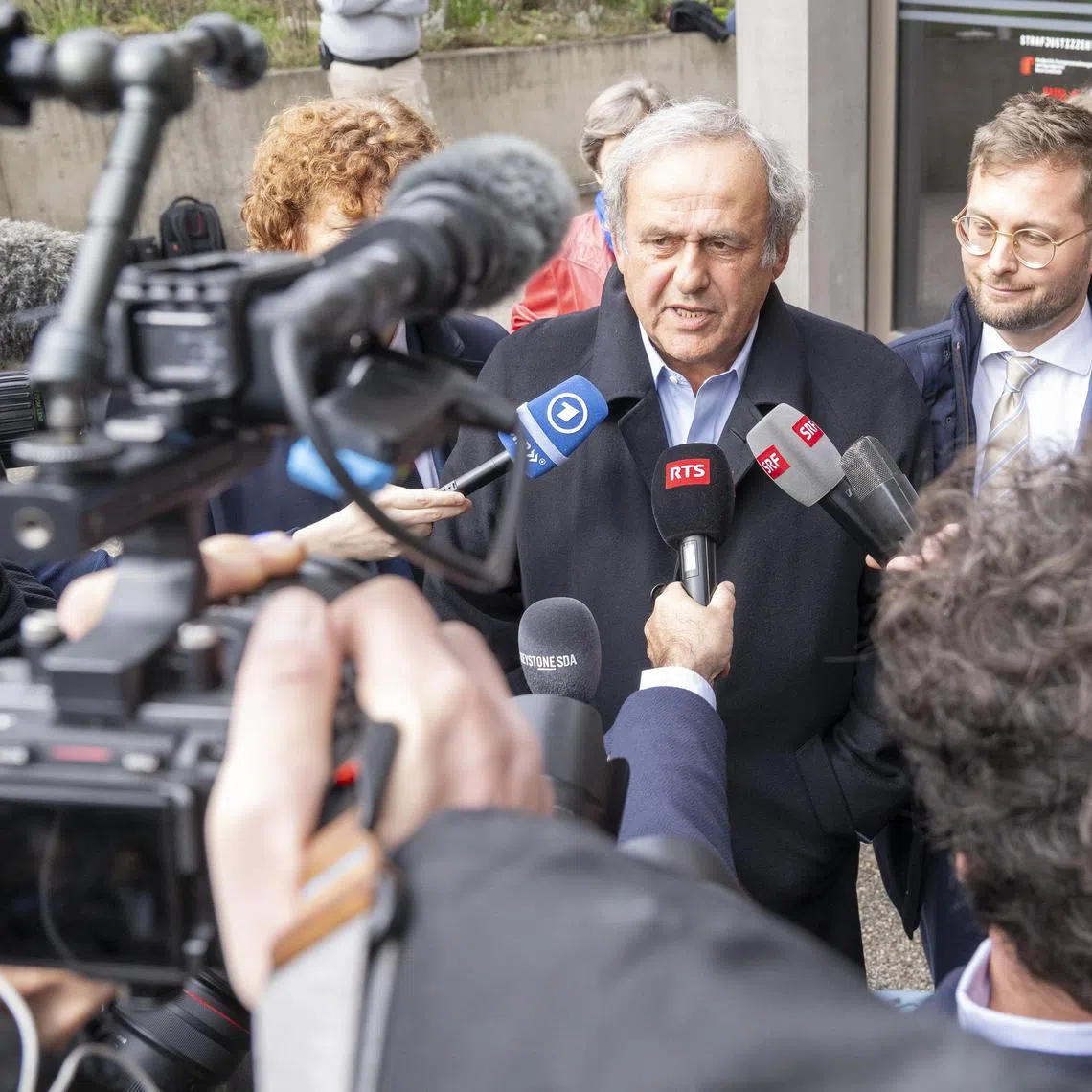 Michel Platini speaking to journalists after a Swiss court  cleared both him and former Fifa president Sepp Blatter of corruption charges.  