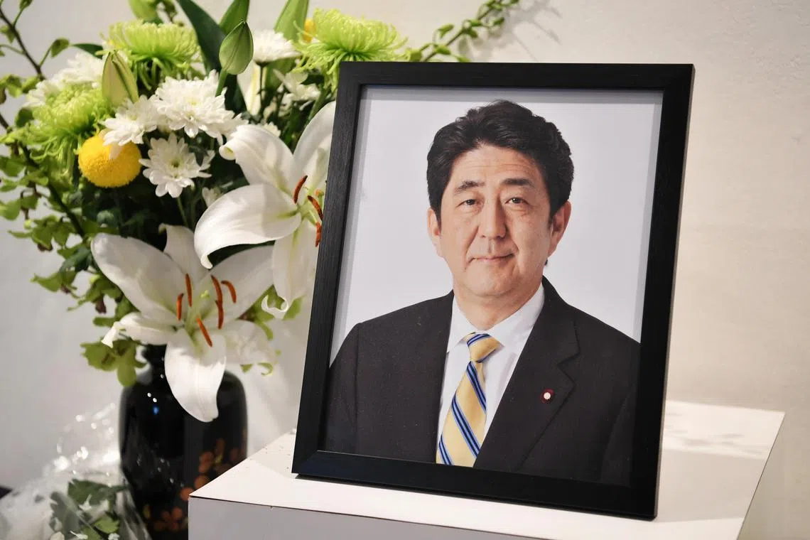 A photo of Japan’s former PM Shinzo Abe at the Japan Creative Centre on July 12, 2022 at the opening of a book of condolences.