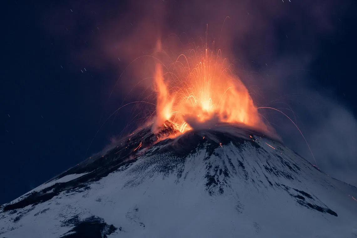 The snow-capped Etna spewing hot lava, near Catania, Sicily island, Italy on Nov 26, 2023. 