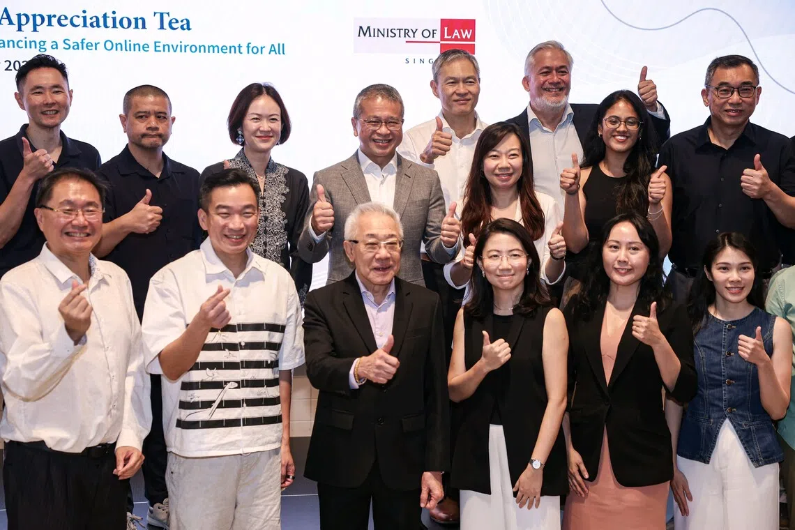 Law Minister Edwin Tong (second row, centre) and Senior Parliamentary Secretary for Social and Family Development Eric Chua (front row, second from left) with partner organisations for OSRAA at the appreciation event on Sept 23.