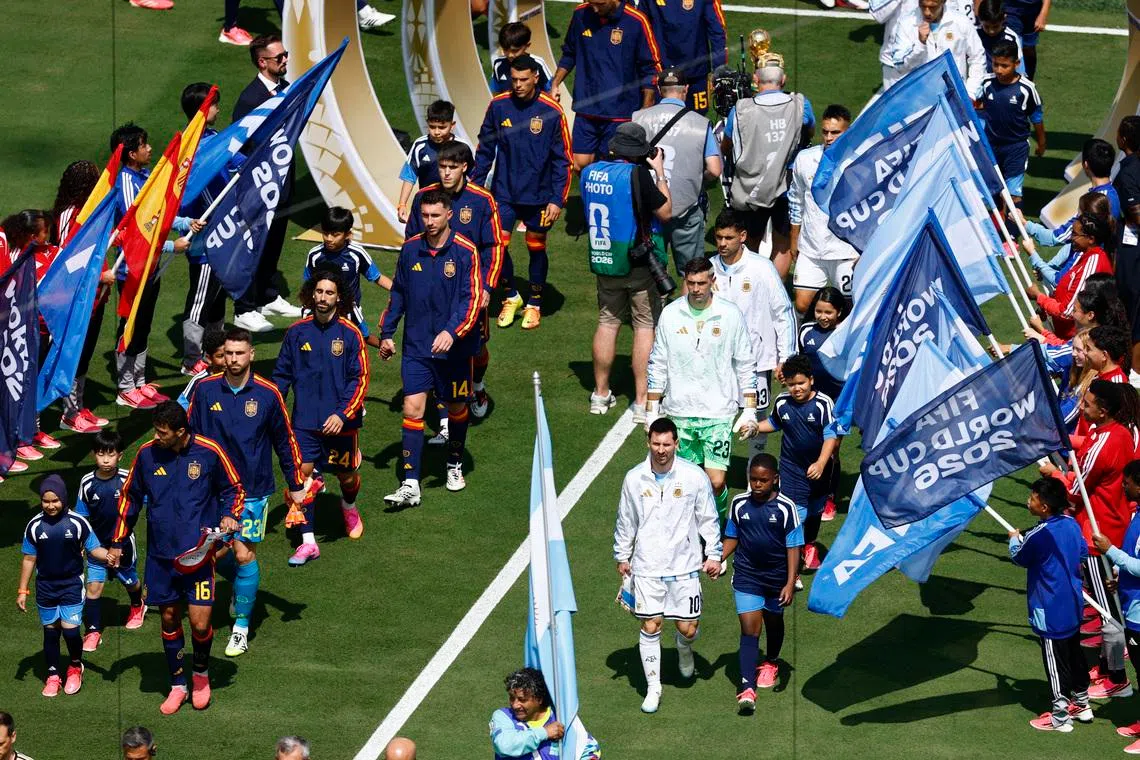 Soccer Football - FIFA World Cup 2026 - Final - Spain v Argentina - New York/New Jersey Stadium, East Rutherford, New Jersey, U.S. - July 19, 2026 Spain's Rodri and Argentina's Lionel Messi lead out their teams before the match REUTERS/Jeenah Moon