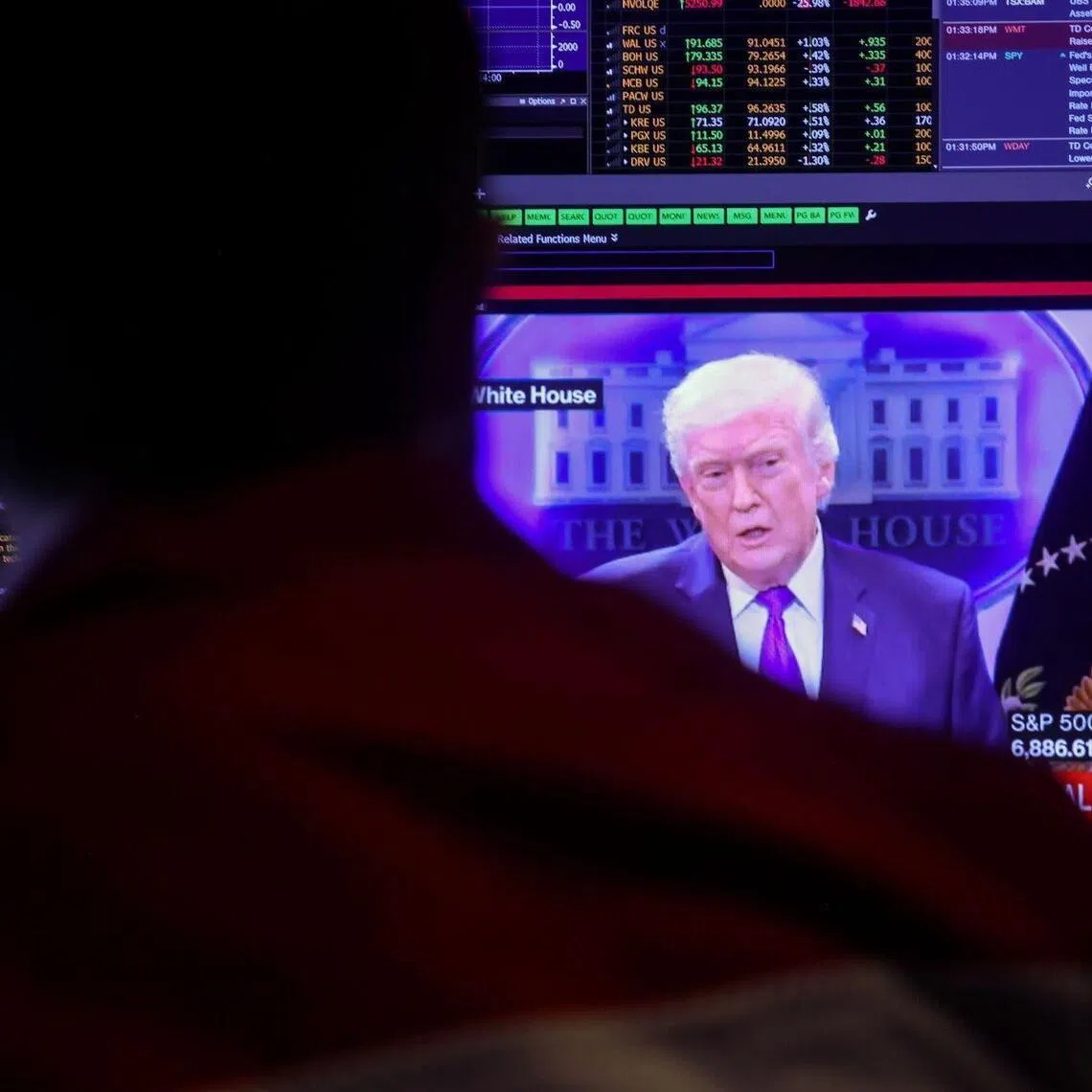 A TV broadcast of US Supreme Court ruling on President Donald Trump's tariffs on the floor of the New York Stock Exchange in New York, US, on Feb 20, 2026.