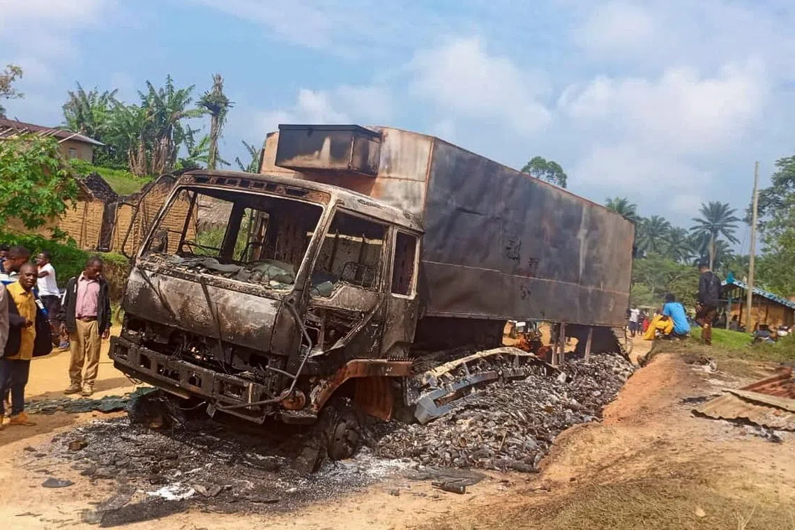 A charred wreckage of a truck stands on a road after it was burnt following an attack by Islamic State-affiliated Allied Democratic Forces (ADF) rebels, in the town of Ntoyo in North Kivu province's Lubero territory, eastern Democratic Republic of Congo September 9, 2025. REUTERS/Stringer