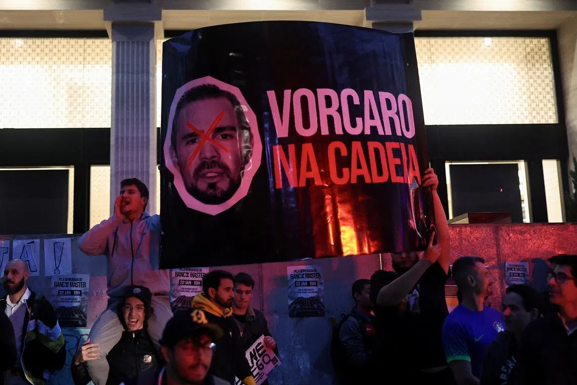 Demonstrators from the right‑wing group Movimento Brasil Livre (MBL) hold a banner reading \"Vorcaro in Jail\" depicting businessman Daniel Vorcaro as they protest outside Banco Master against alleged scandals, calling for investigation and accountability, in Sao Paulo, Brazil, January 22, 2026. REUTERS/Amanda Perobelli