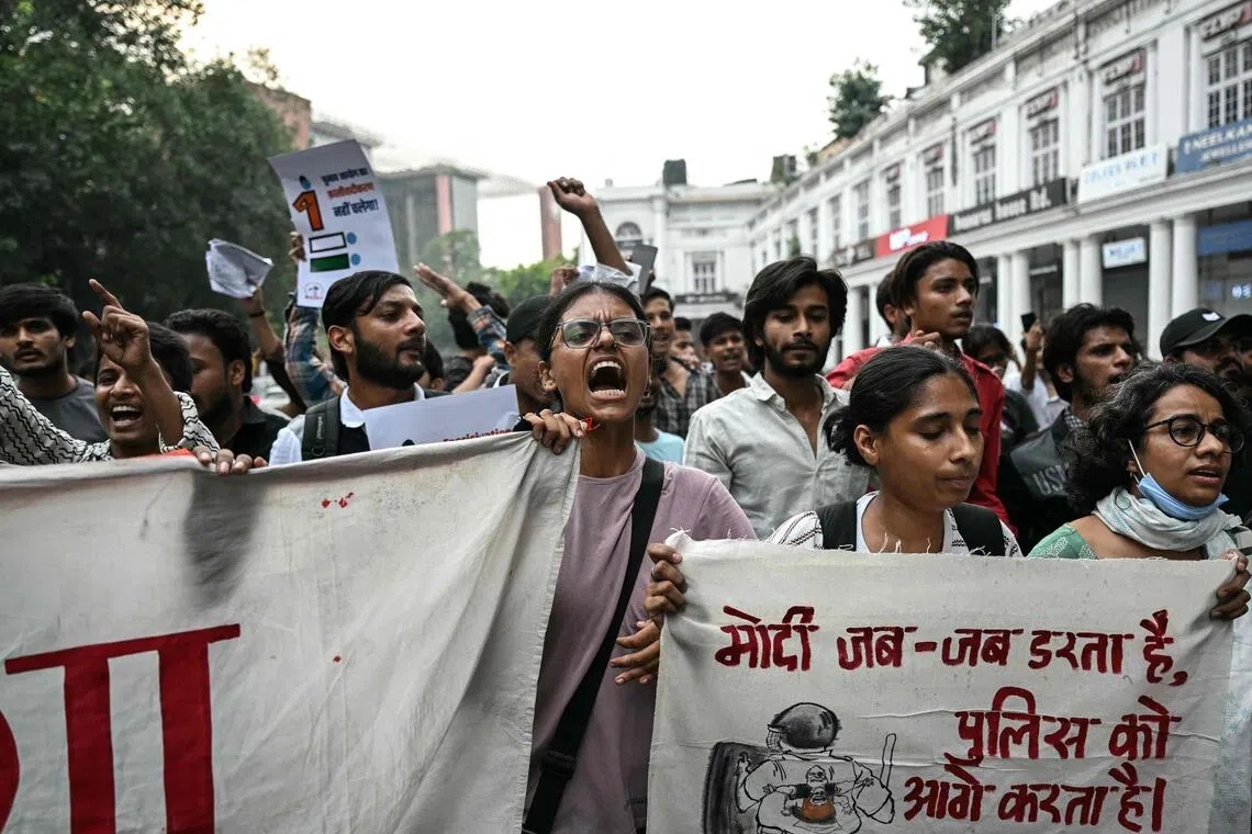 Demonstrators shout slogans during a protest demanding the resignation of India’s Chief Election Commissioner Gyanesh Kumar over alleged voter roll irregularities.
