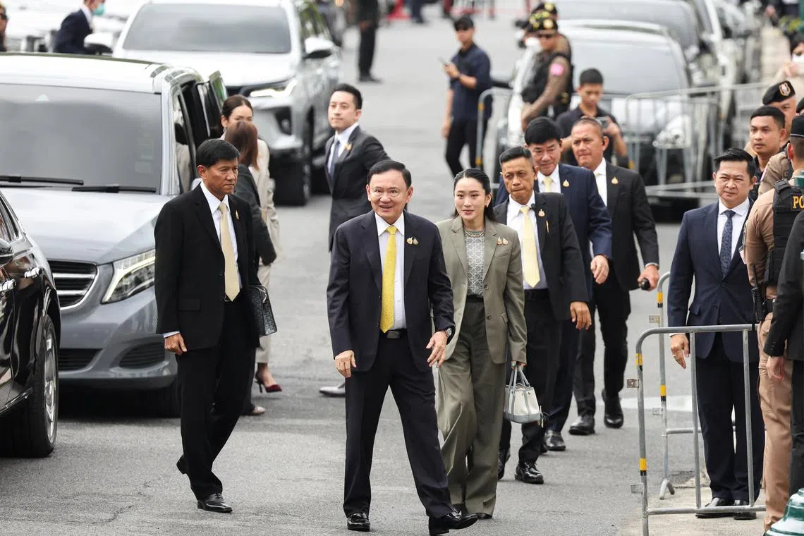 Former Thai Prime Minister Thaksin Shinawatra and his daughter Paetongtarn Shinawatra arrive at the Supreme Court ahead of a verdict on the legality of Thaksin's six-month hospital stay before he was granted a parole, in Bangkok, Thailand, September 9, 2025. REUTERS/Athit Perawongmetha