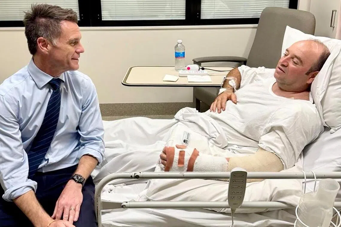 New South Wales Premier Chris Minns (left) talking with Ahmed Al Ahmed, the man who tackled and disarmed one of the Bondi beach attackers on Dec 15, 2025.
