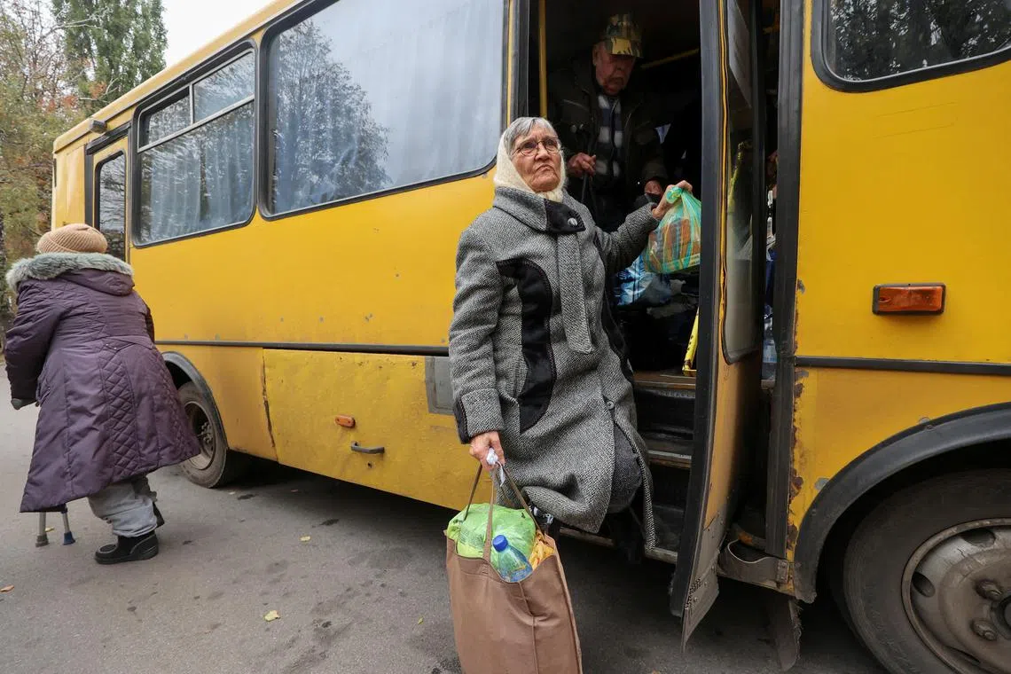 Residents arriving at an evacuation centre in the Ukrainian city of Kharkiv, after being evacuated from Kupyansk, in October 2024.