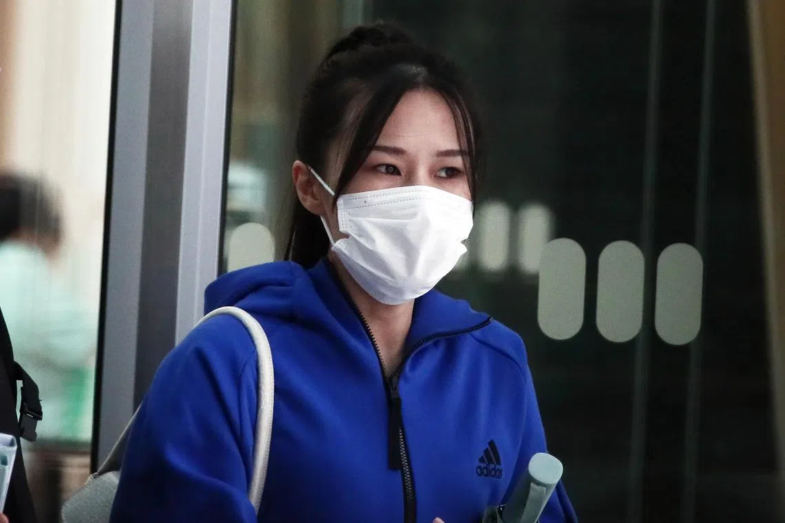 Huang Mengting leaving State Courts on Aug 23, 2022. She was convicted of four counts of cheating.