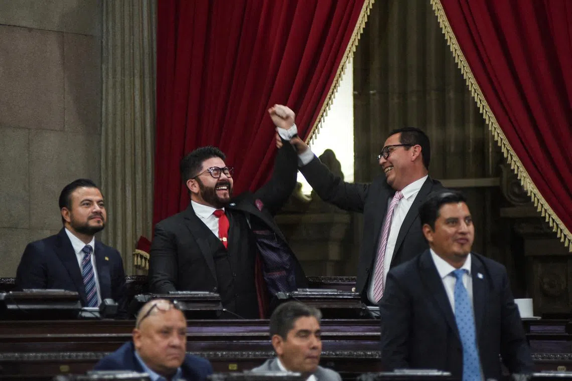 Lawmakers react during a session to elect new judges for the electoral court, as part of a process to renew senior officials in the judicial system that has drawn criticism from organizations such as the United Nations, which warn of the risk of it being co-opted by powerful groups, in the Guatemalan Congress, in Guatemala City, Guatemala, on March 10, 2026. REUTERS/Cristina Chiquin