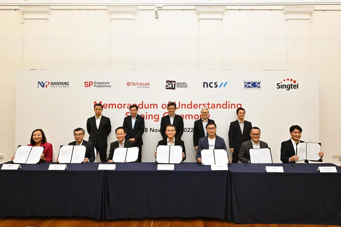 Education Minister Chan Chun Sing (back row, third from left), was the guest of honour at the event where SIT inked a memorandum of understanding with three industry partners.