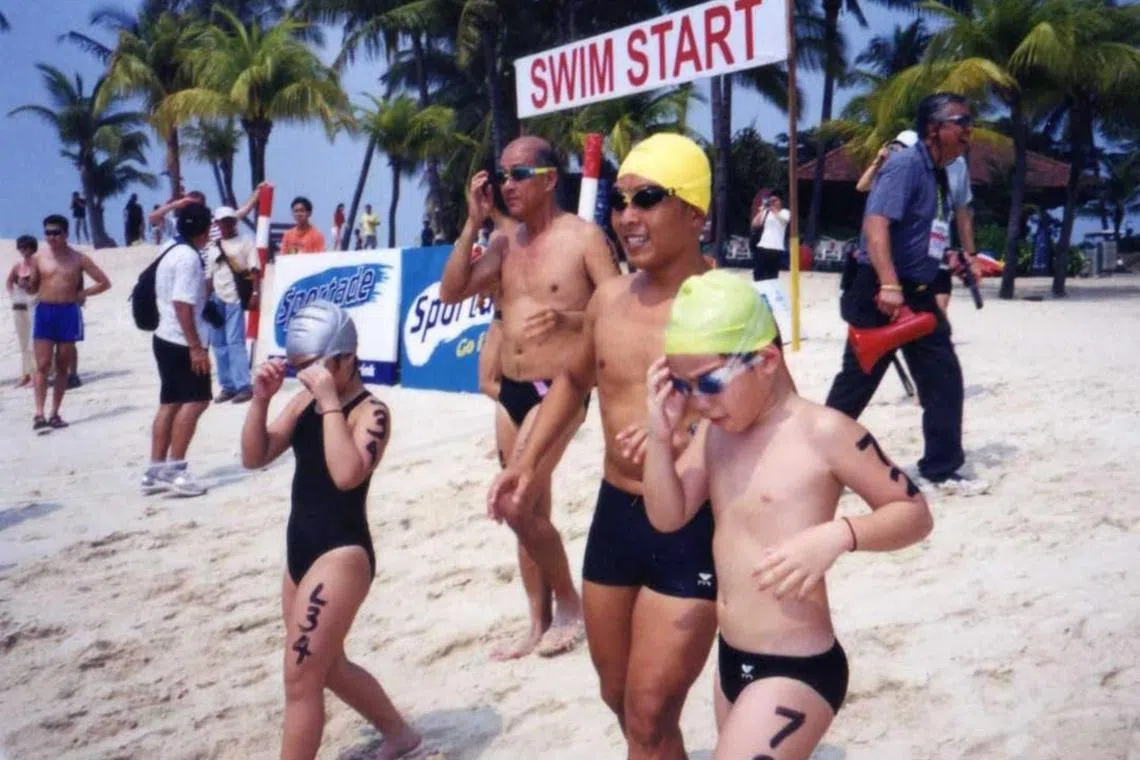 Three generations of triathletes, the late Ng Yoo Ay (second from left), eldest son Ng See Chye and grandson James Ng (Green cap).