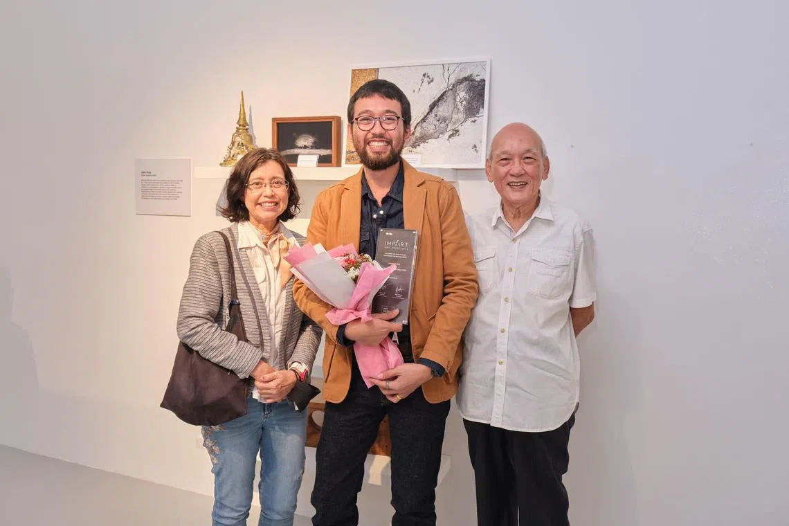 John Tung, winner of the Tan Boon Hui Curatorial Prize by Art Outreach with his parents Peter Tung (right) and Maria Leo at the award ceremony on Feb 22.