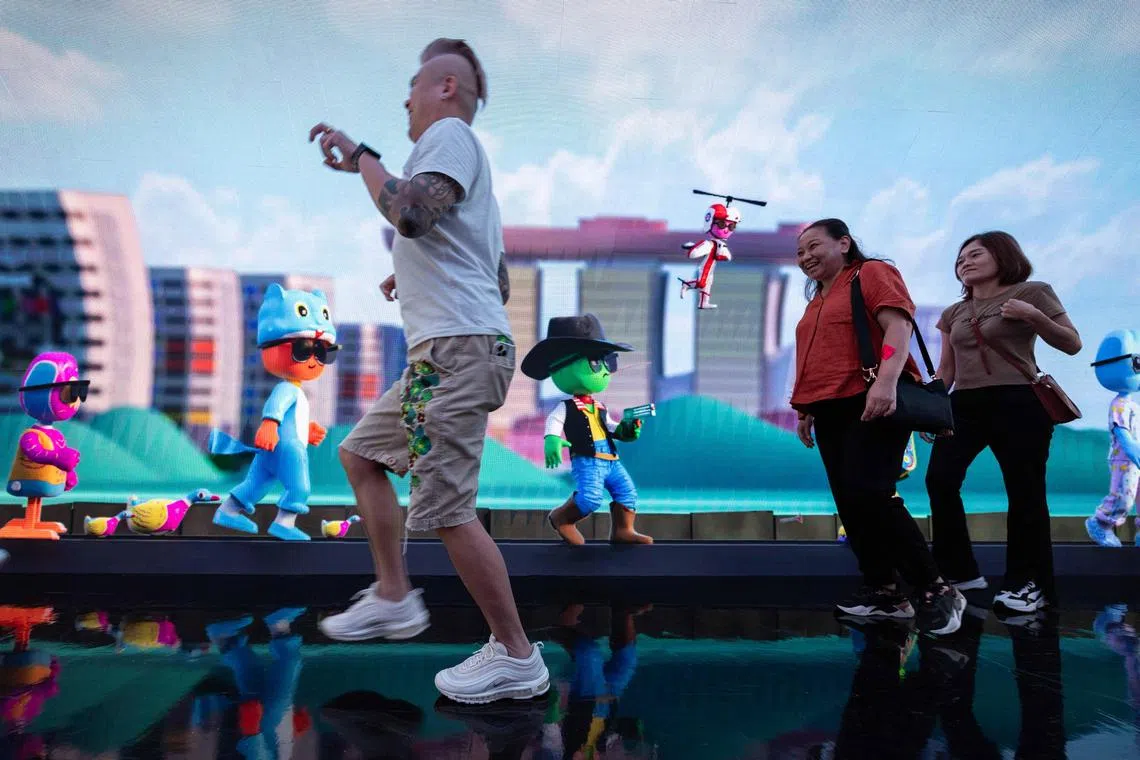 A member of the public poses in the tunnel with Gman.