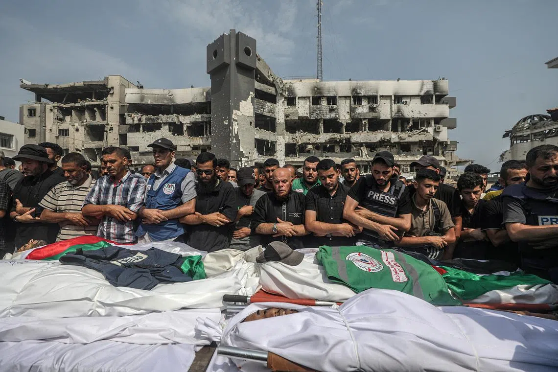 Palestinians attend the funeral of journalists from Qatari broadcaster Al Jazeera killed by Israel on Aug 10, 2025.