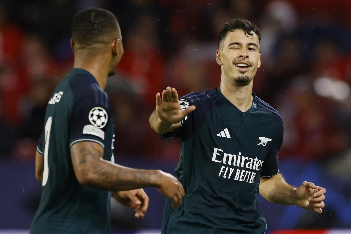 Arsenal's Gabriel Martinelli (right) celebrates scoring their first goal against Sevilla with Gabriel Jesus.