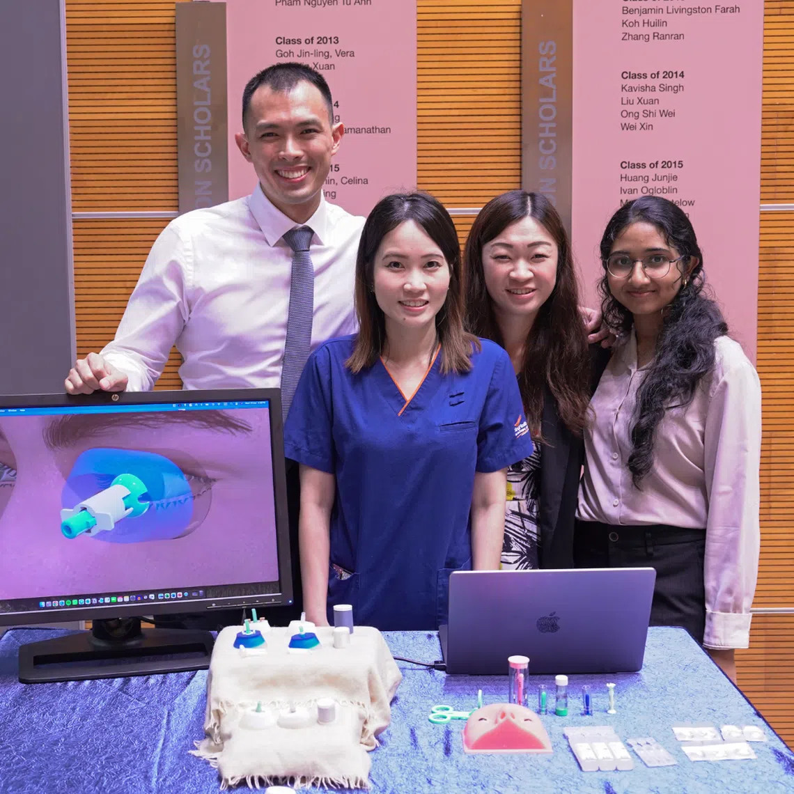 Dr Foo Li Lian (second from left) together with Team ReVision, the winning team for Duke-NUS' annual health innovator challenge this year.