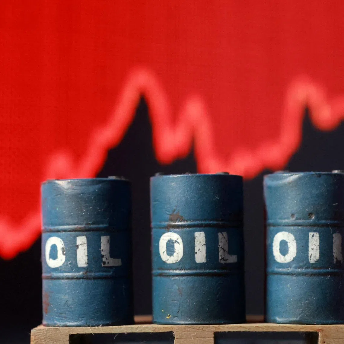 3D printed oil barrels and rising stock graph are seen in this illustration taken March 23, 2026. REUTERS/Dado Ruvic/Illustration/File Photo
