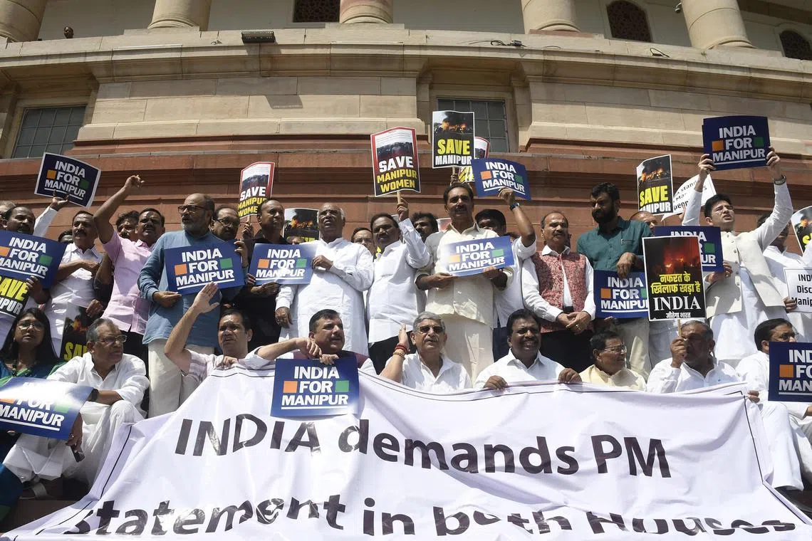 epa10766028 Members of newly formed Indian National Democratic Inclusive Alliance by the all opposition parties protest over ethnic violence in Manipur during Monsoon session of Parliament, in New Delhi, India, 24 July 2023. Members of opposition parties held a protest on Parliament premises demanding Indian prime minister Narendra Modi's statement on Manipur violence in both houses of the Indian parliament.  EPA-EFE/MANISH JAIN