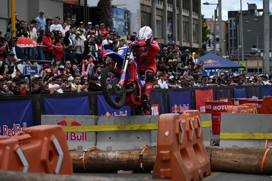 Chilean rider Camilo Herrera competes during the first enduro race held through the streets of the city at the Red Bull Moto Urbano event in Bogota on August 2, 2026. (Photo by Raul ARBOLEDA / AFP)