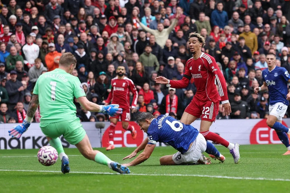 Liverpool's Hugo Ekitike scores their second goal past Everton's Jordan Pickford.