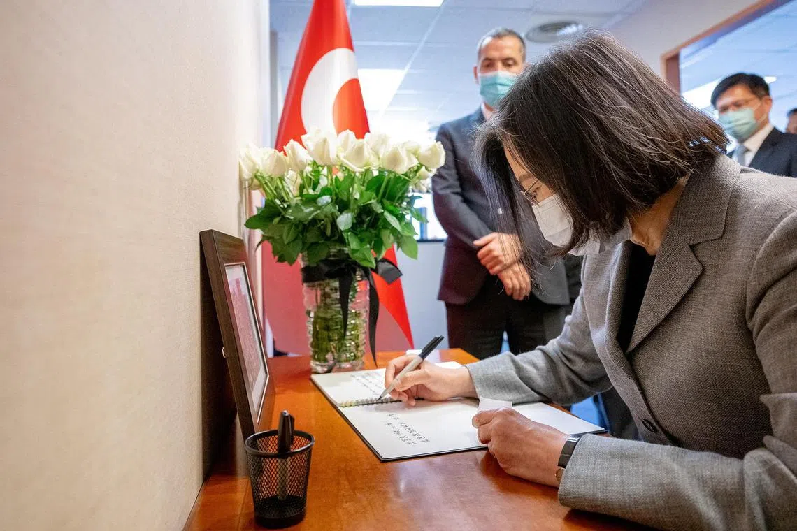 Taiwan President Tsai Ing-wen signs a book of condolence for Turkey quake victims at the Turkish Trade Office in Taipei, Taiwan.