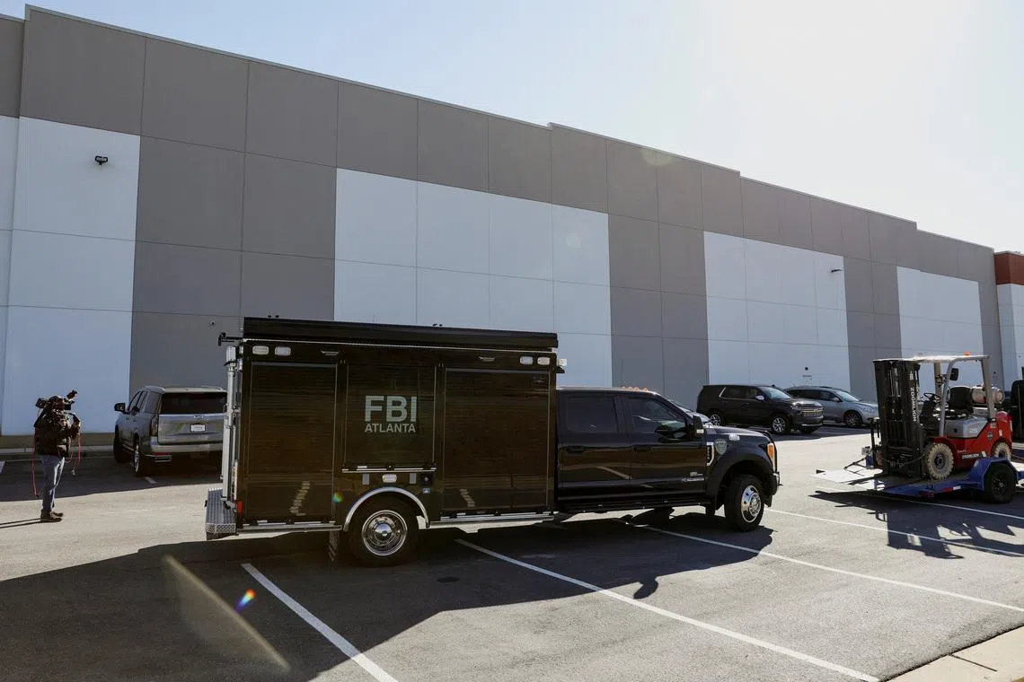 A vehicle of the Federal Bureau of Investigation (FBI) is parked outside the Fulton County Election Hub and Operation Center after the FBI executed a search warrant there in relation to the 2020 election, according to a law enforcement official familiar with the matter, in Union City, Georgia, U.S. January 28, 2026.  REUTERS/Alyssa Pointer