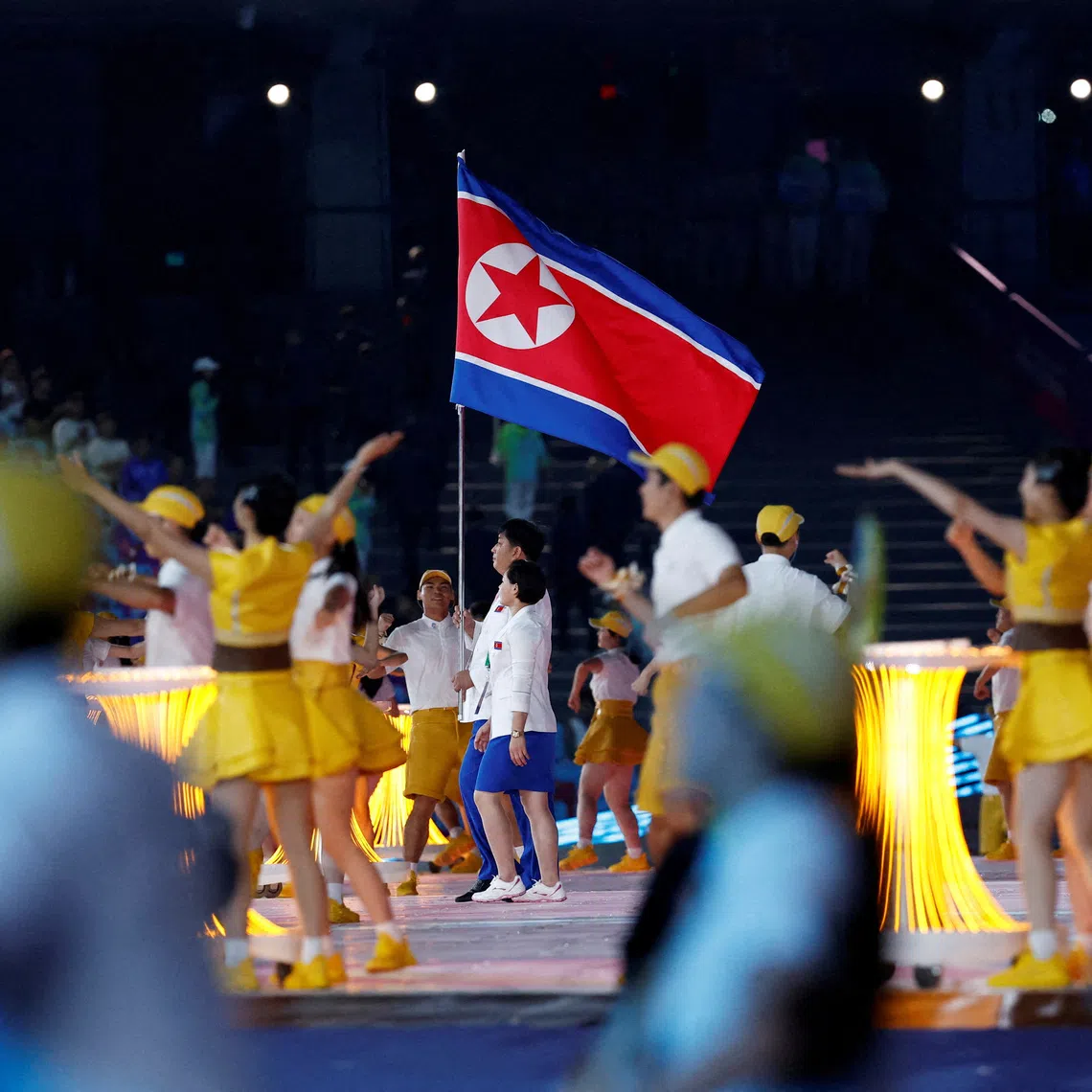 FILE PHOTO: Asian Games - Hangzhou 2022 - Opening Ceremony - Hangzhou Olympic Sports Center Stadium, Hangzhou, China - September 23, 2023 Athletes from North Korea hold their national flag at the Opening Ceremony REUTERS/Tingshu Wang./File Photo