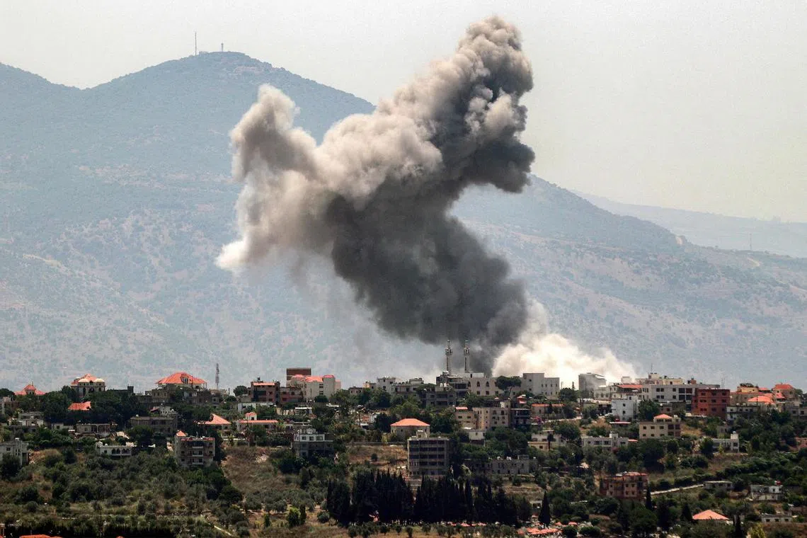 Smoke billows during an Israeli bombardment on the village of Khiam in south Lebanon near the border with Israel.