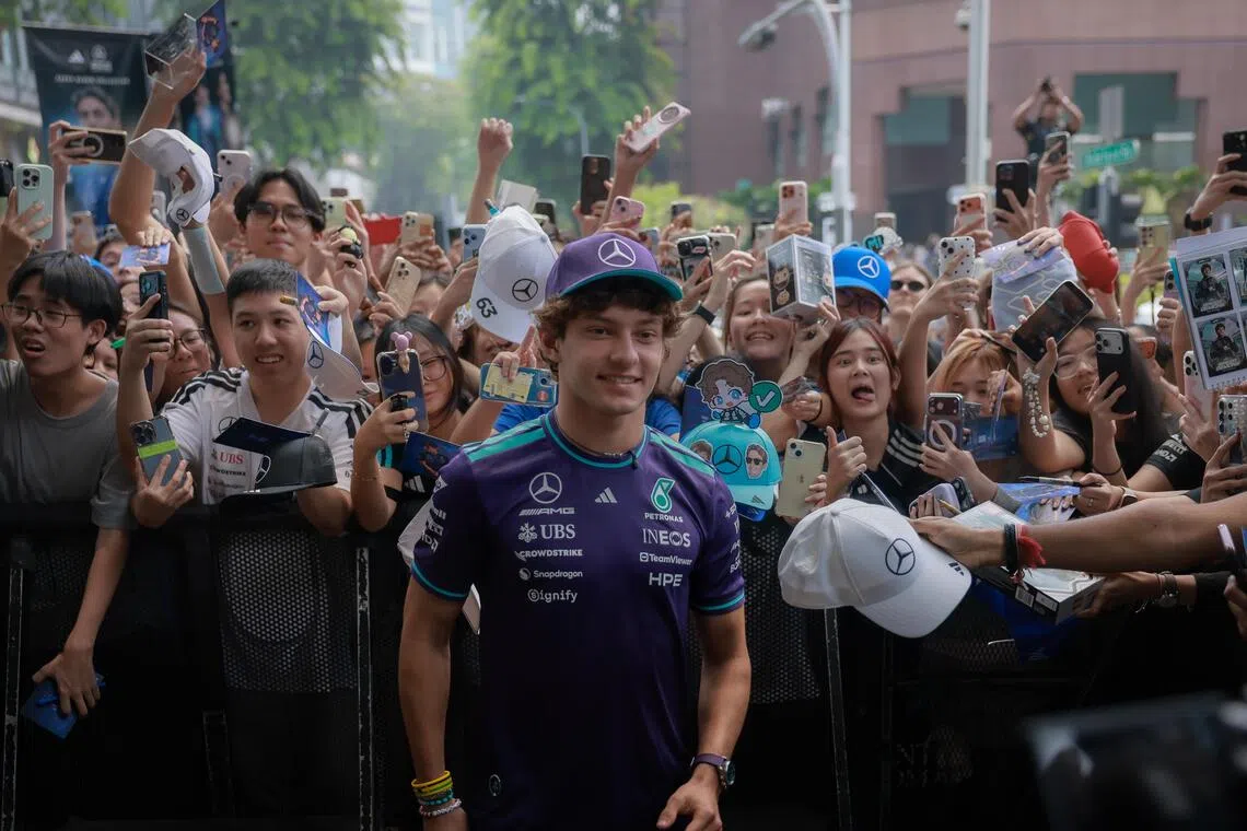 Mercedes Formula One driver Kimi Antonelli poses for photographs and signs autographs for fans at the Adidas Brand Centre Orchard on Oct 8.