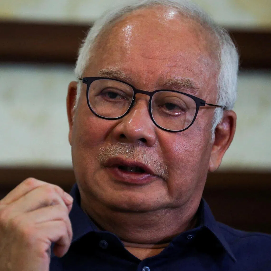 FILE PHOTO: Malaysia's former Prime Minister Najib Razak speaks during an interview with Reuters in Kuala Lumpur, Malaysia September 18, 2021. Picture taken September 18, 2021. REUTERS/Lim Huey Teng/File Photo