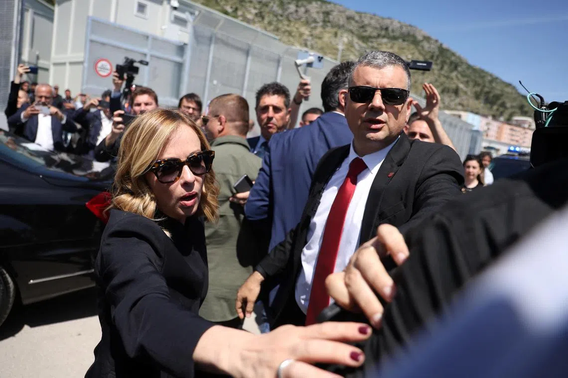 Italian Prime Minister Giorgia Meloni was confronted by a person opposing the deal, as she visited the construction site in Shengjin, Albania, on June 5.