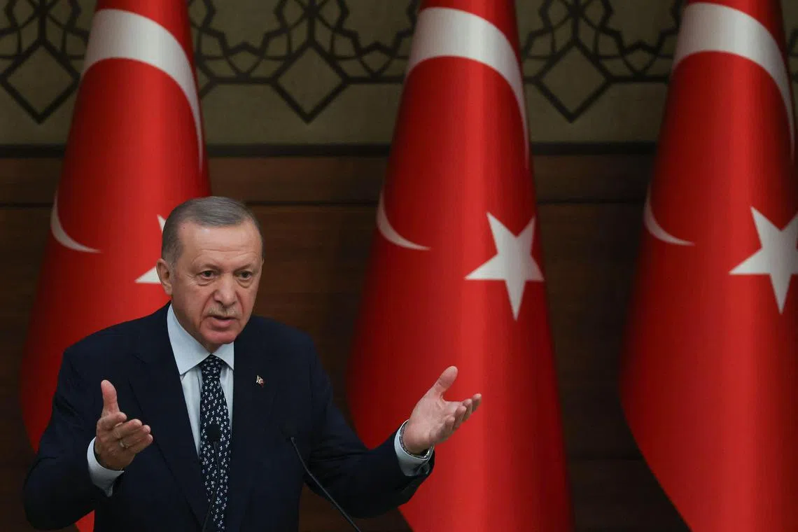 Turkish President Recep Tayyip Erdogan delivers a speech at the International Ombudsman Conference at the presidential complex in Ankara, Turkey, on January 11, 2023. - Ukrainian Parliament Commissioner for Human Rights Dmytro Lubinets (Ombudsman) and High Commissioner for Human Rights of the Russian Federation Tatiana Moskalkova asked Turkish President Recep Tayyip Erdogan to act as a mediator to establish a humanitarian corridor to evacuate women, children and wounded in Ukrainian territories engaged in conflict, reported Turkish mediator Seref Malkoc. (Photo by Adem ALTAN / AFP)