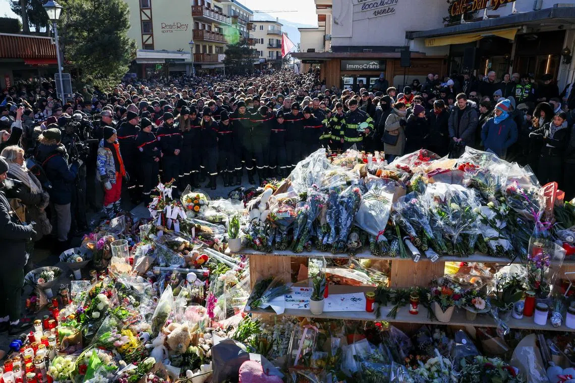 Crans-Montana fire: Grieving Swiss town holds silent procession for victims of deadly bar blaze